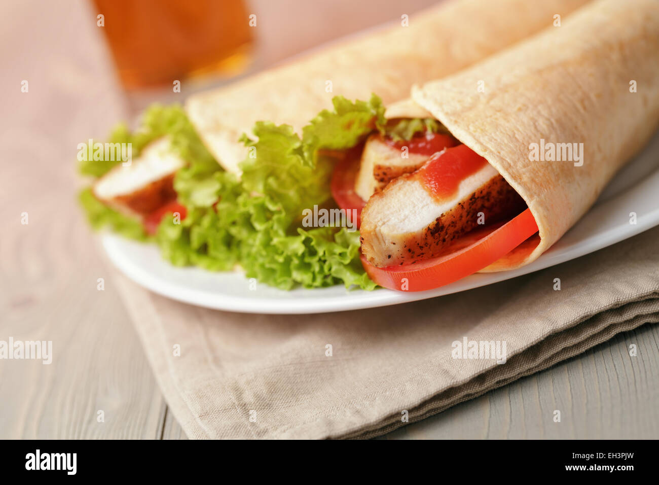 freshly made tortilla wraps with chicken and vegetables Stock Photo