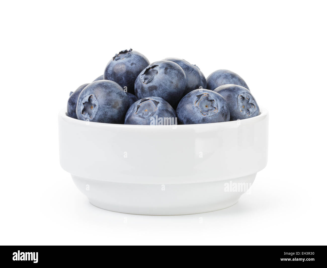 fresh ripe blueberries in white bowl Stock Photo