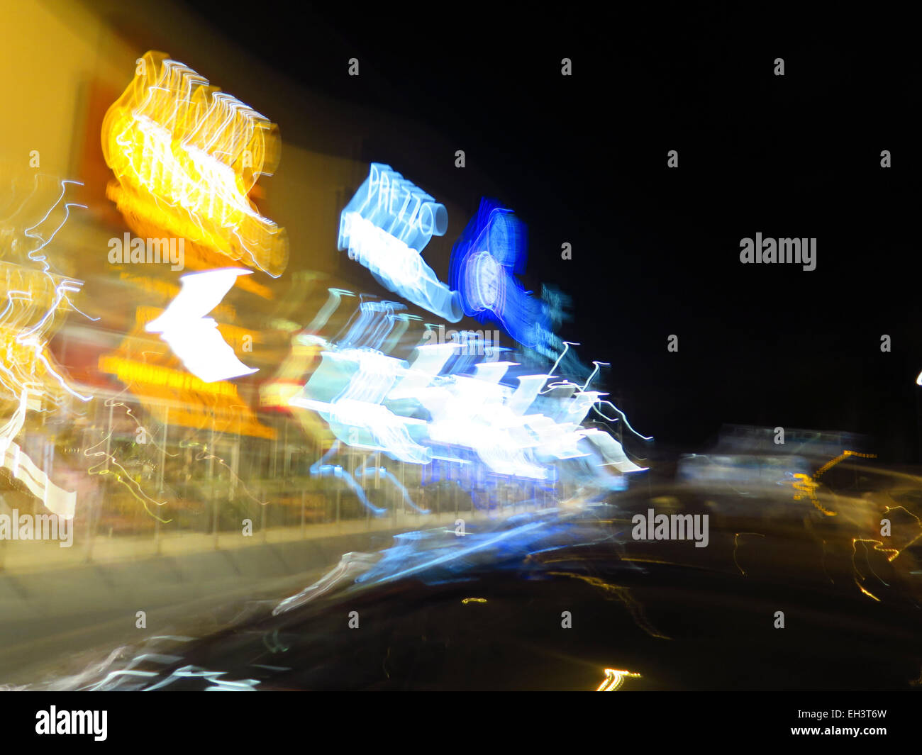 Motion blur of UK restaurant chains at night Stock Photo