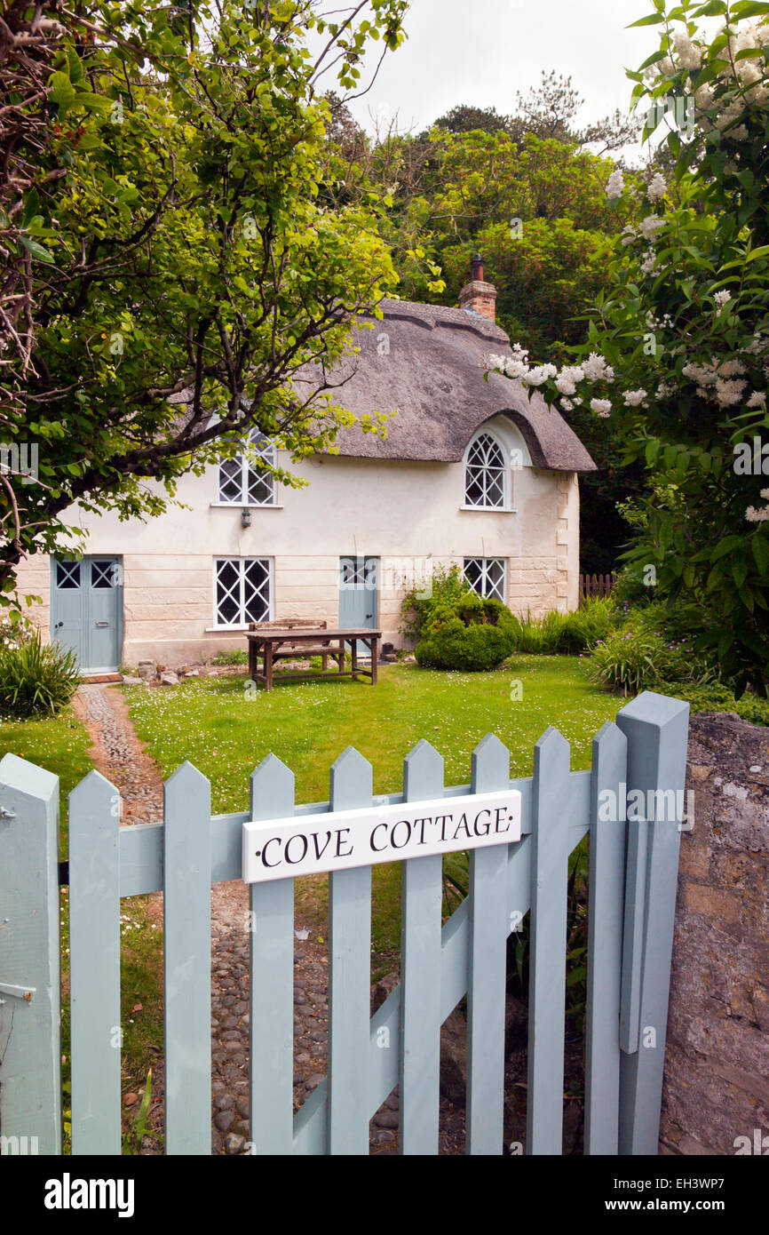 The picturesque thatched Cove Cottage at Lulworth Cove on the Jurassic Coast, Dorset, England, UK Stock Photo