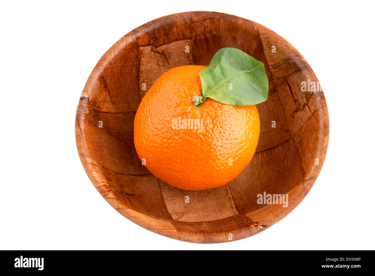 Single mandarin in wooden bowl Isolated Stock Photo Alamy