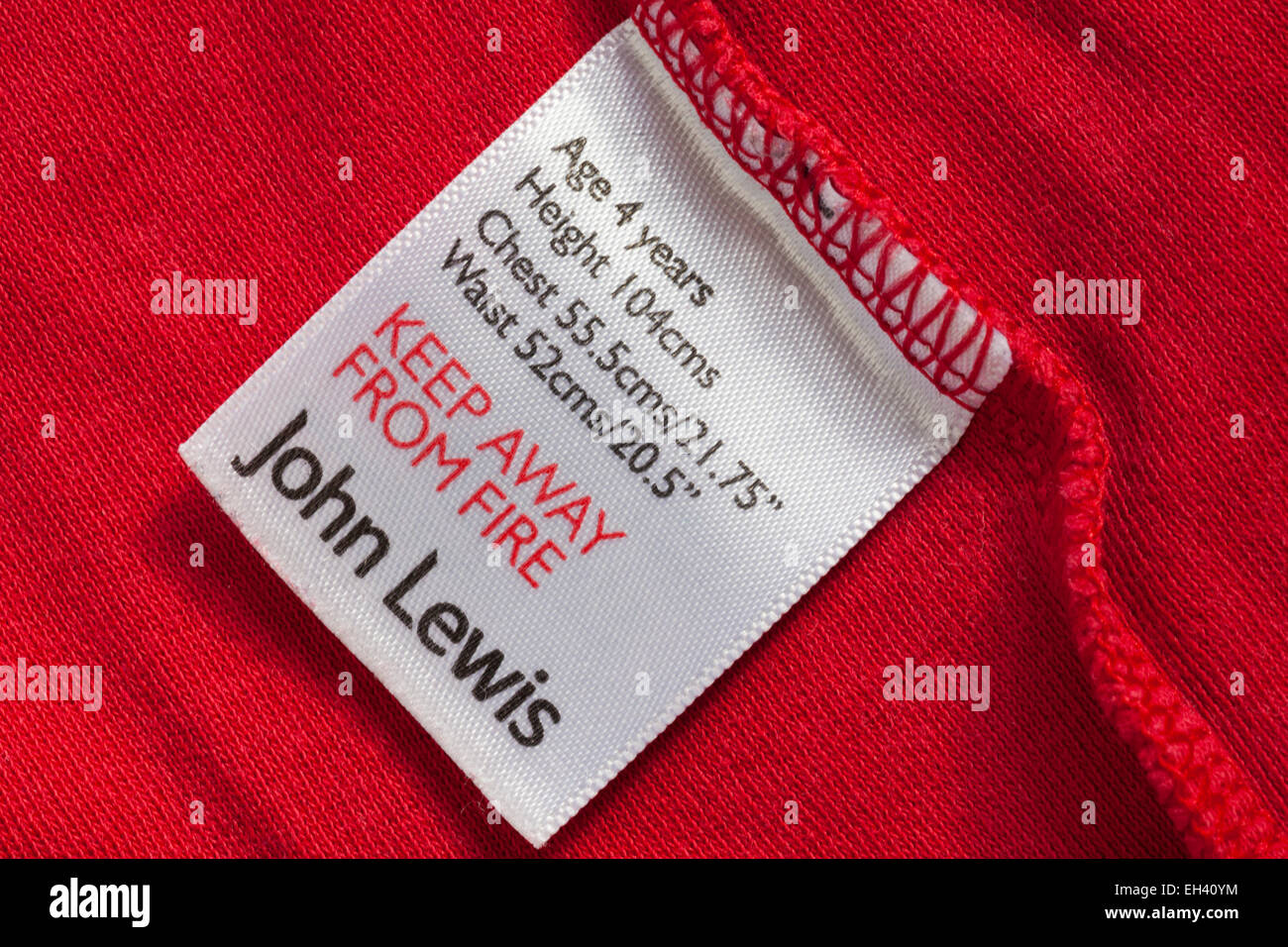 keep away from fire John Lewis label in child's top garment part of