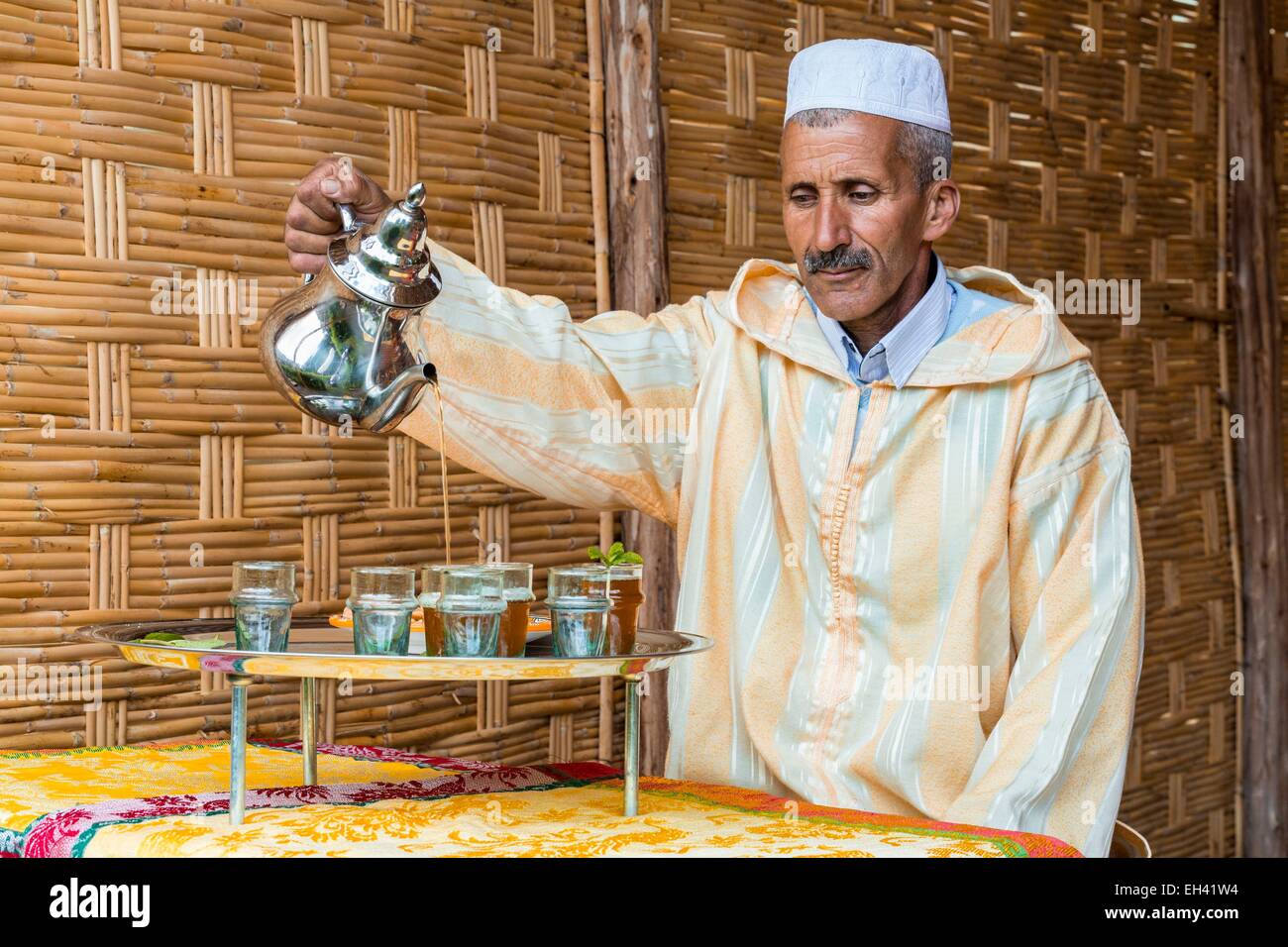 Morocco, High Atlas, Marrakech, Douar Dchera, mint tea server Stock Photo