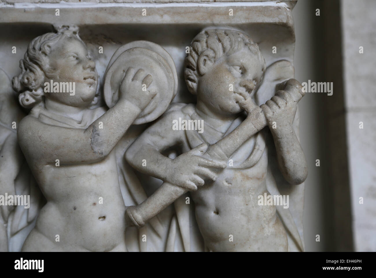 Roman art. Front panel of the sarcophagus adorned with a relief. Eros playing musicals instruments. Vatican Museums. Stock Photo