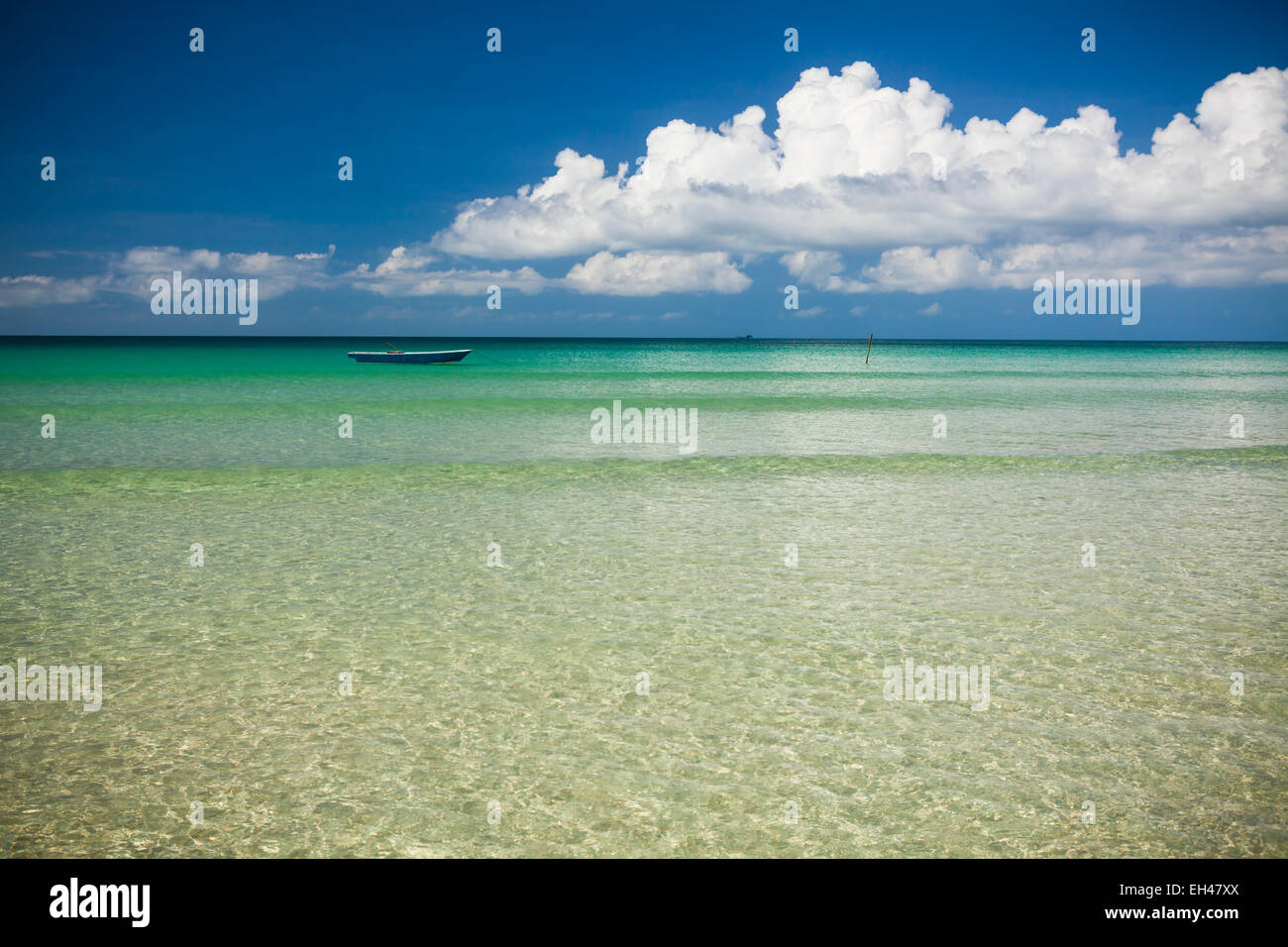Fisher boat and clear turquoise water Stock Photo - Alamy
