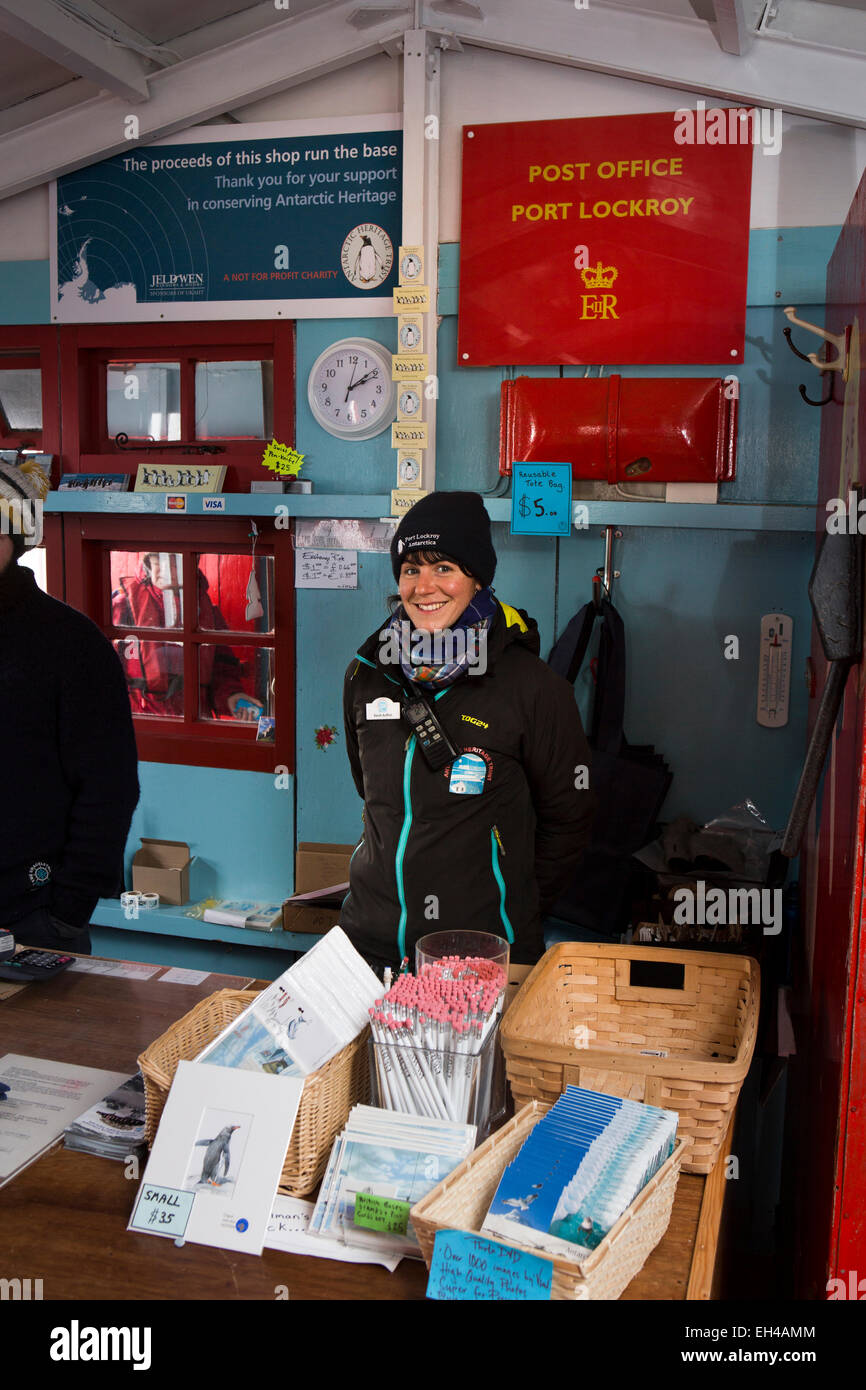 Antarctica, Goudier Island, Port Lockroy British base, worker Sarah Aufrett serving in shop Stock Photo