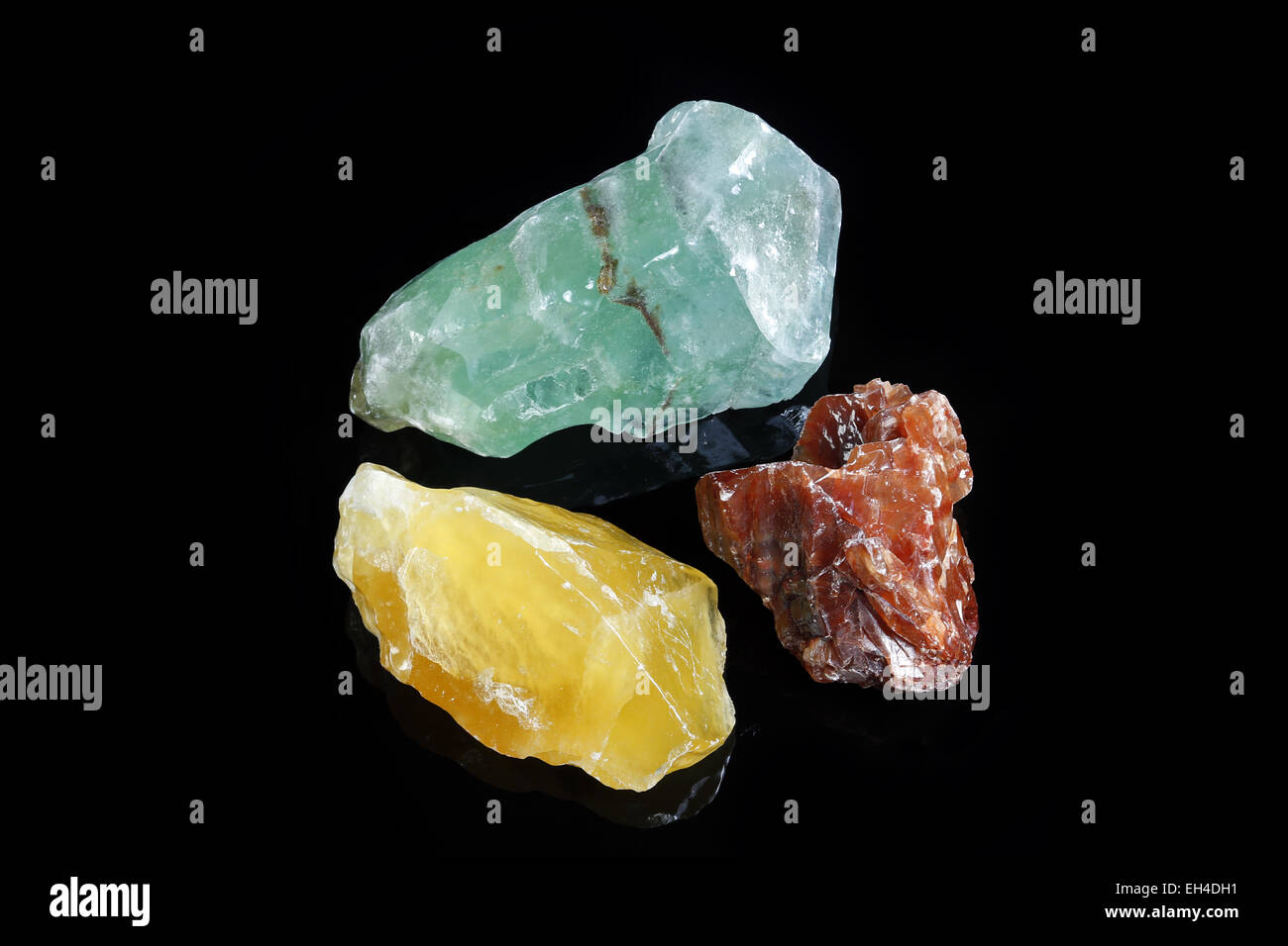 Yellow, Red and Green Calcite, black background Stock Photo