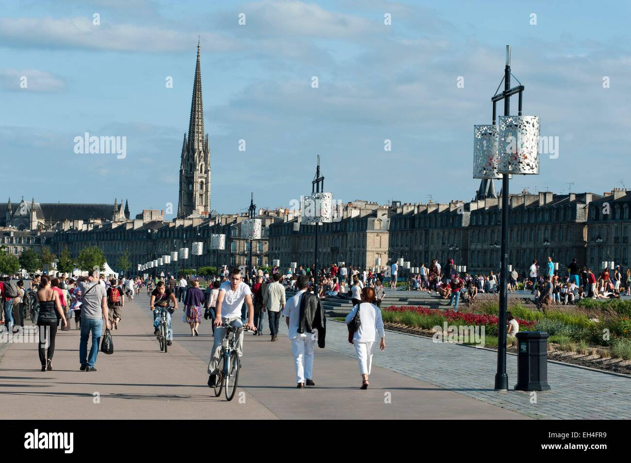 France, Gironde, Bordeaux, area listed as World Heritage Area by UNESCO, Place de la Bourse and Water Mirror work by Michel Courajoud, crowd, bell tower of the Saint Michel Basilica of the 16th century Stock Photo