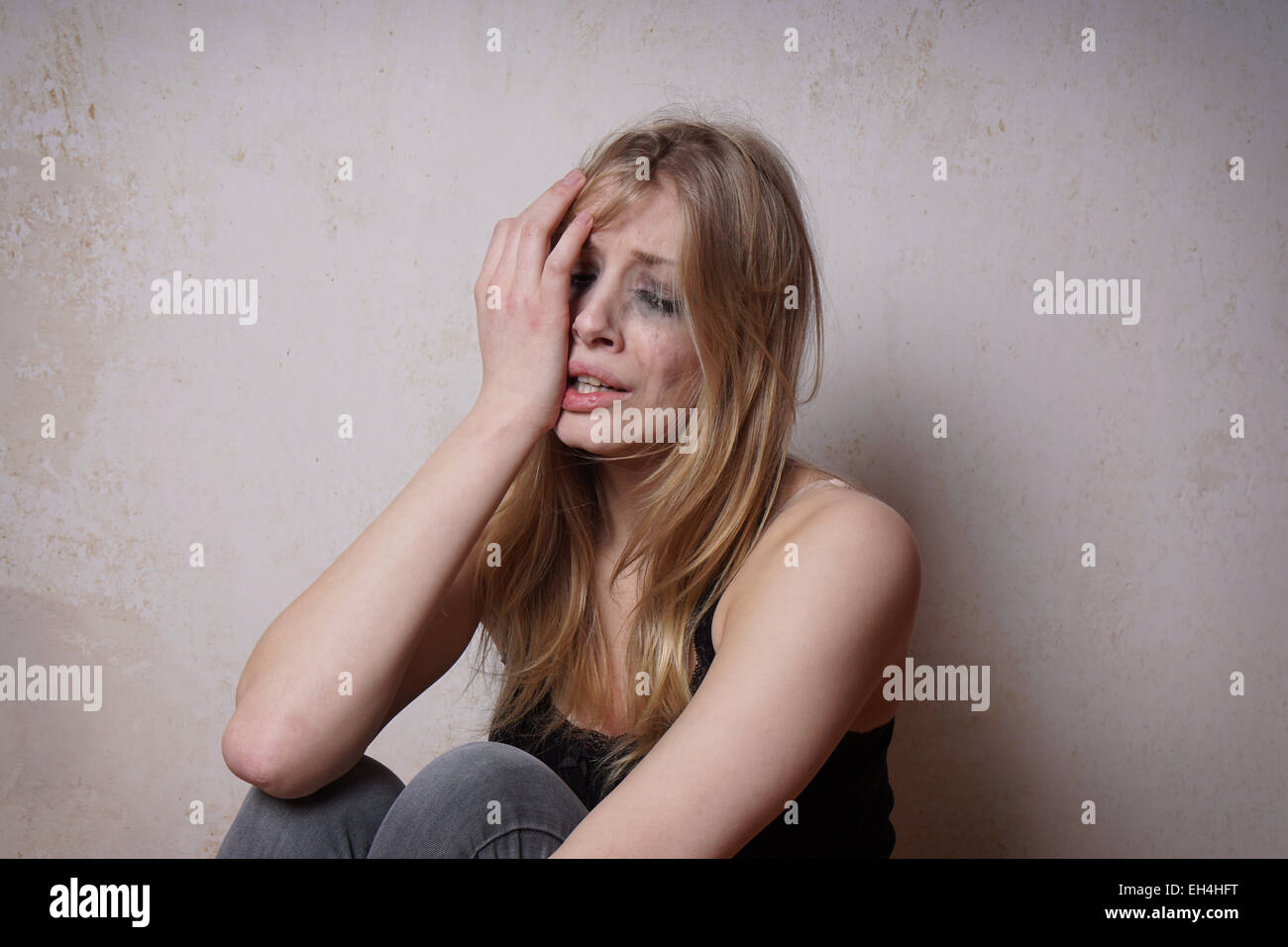 tear-stained young woman Stock Photo