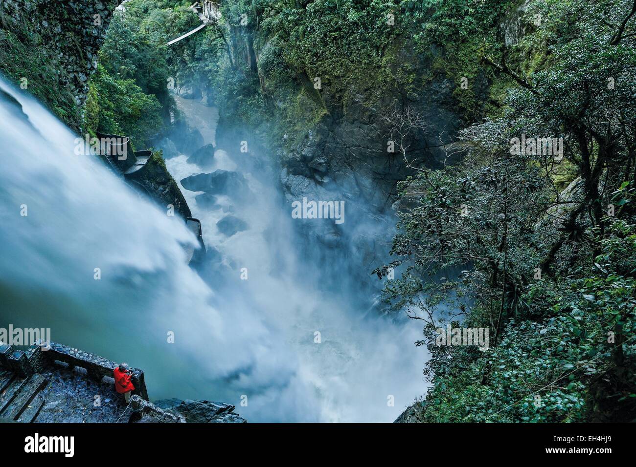 Ecuador, Tungurahua, Banos de Agua Santa, Pailon del Diablo, tourist at the foot of a waterfall in grooves in a tropical greenery Stock Photo