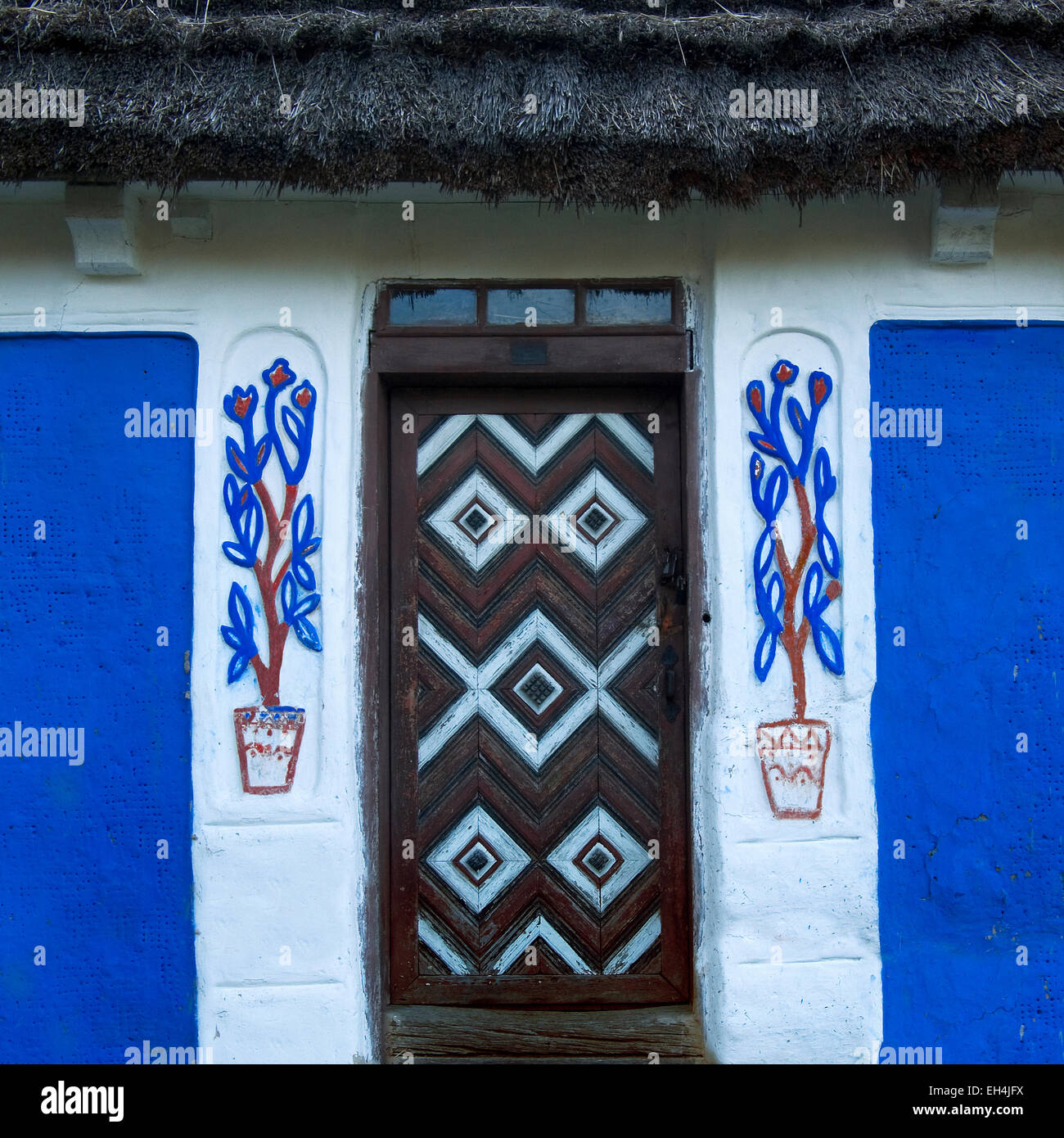 Fragment of a clay house and the door in a folk style.Ukraine,Kiev,Museum.square Stock Photo