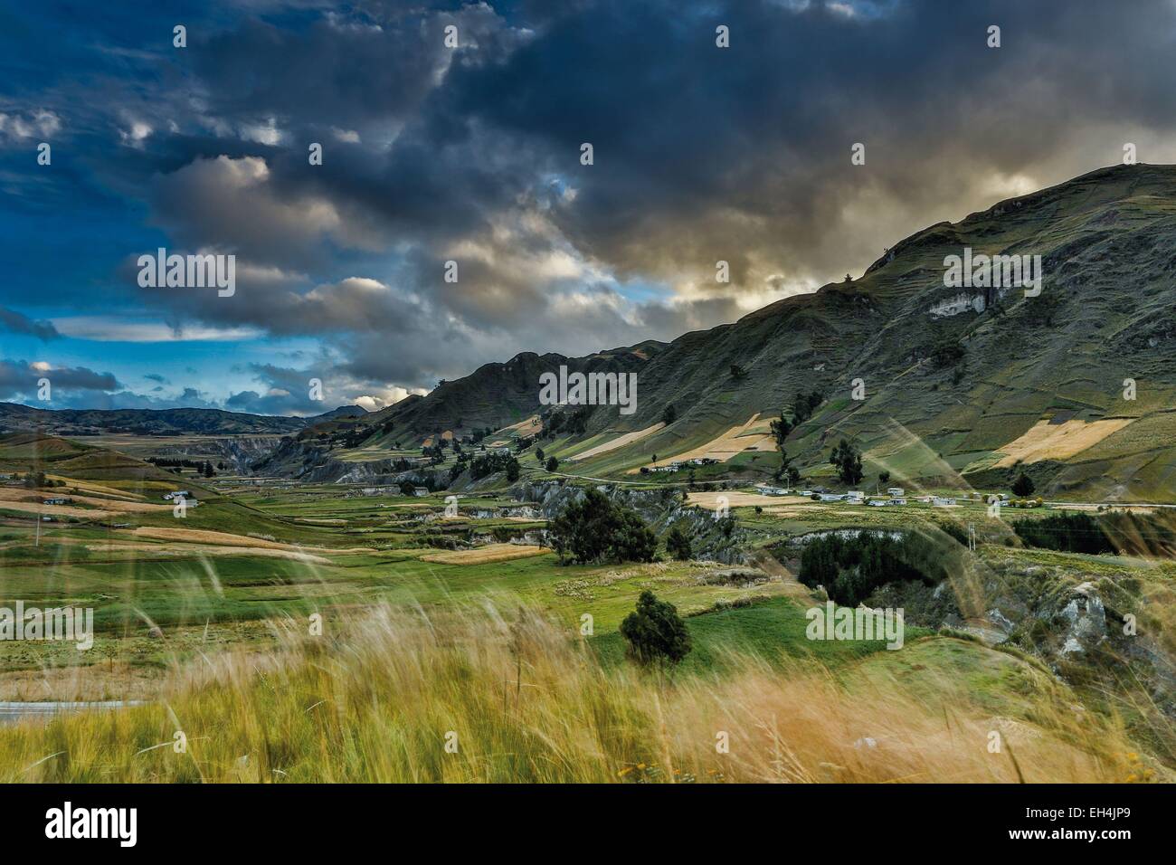 Ecuador, Cotopaxi, Zumbahua, mountainous Andean landscape of plains and canyons under a cloudy sky at sunrise Stock Photo