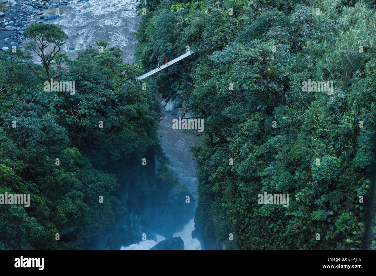 Ecuador, Tungurahua, Banos de Agua Santa, Pailon del Diablo, tourists on a bridge over a gorge in tropical greenery Stock Photo