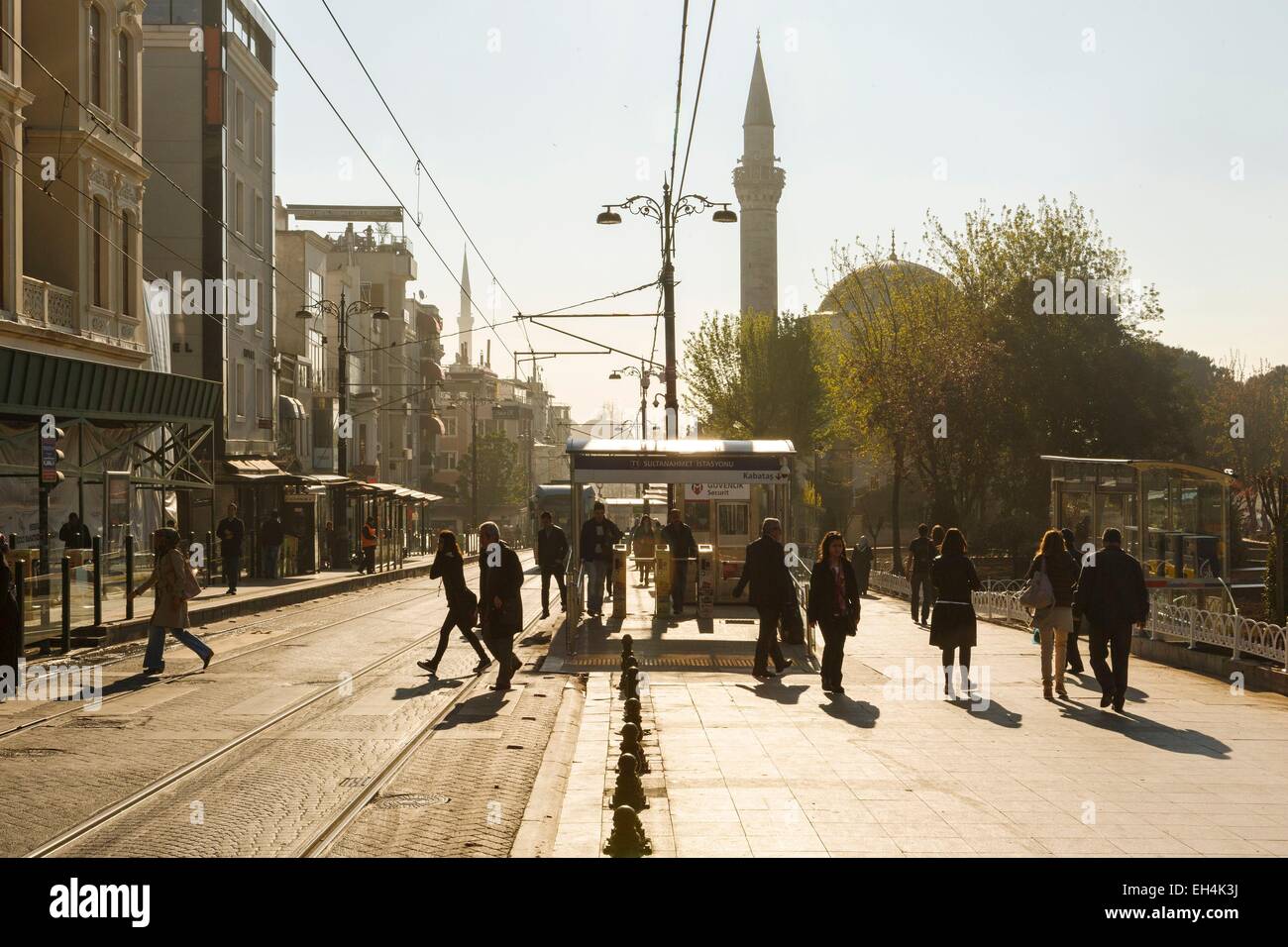 Turkey, Istanbul, users crossing the tram line at the Sultanahmet stop against the light Stock Photo