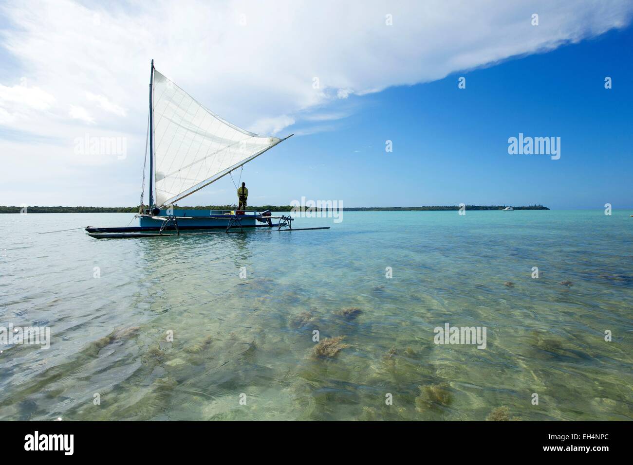 France, New Caledonia, Isle of Pines, outrigger boat in the bay of Saint Joseph, Lagoon listed as World Heritage by UNESCO Stock Photo