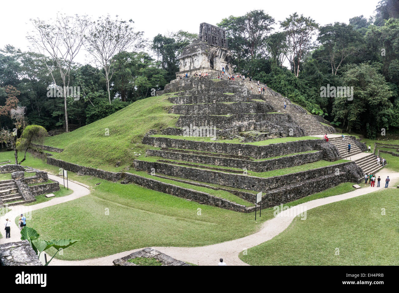 view of magnificent jungle swathed Temple of the Cross with well preserved roof comb in ancient Mayan city of Palenque Chiapas Stock Photo