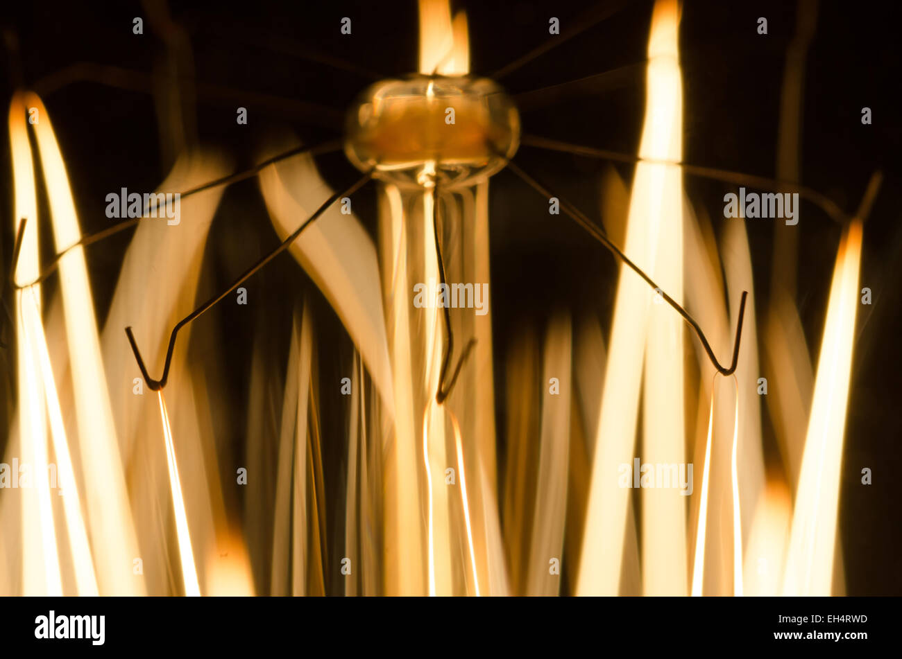 A close-up of a light bulb on a black background Stock Photo