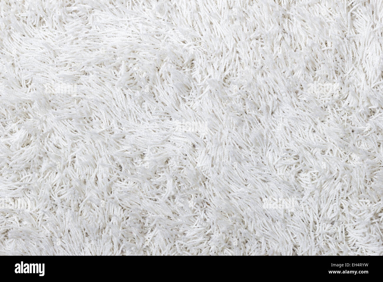 Closeup of a white shaggy carpet texture Stock Photo