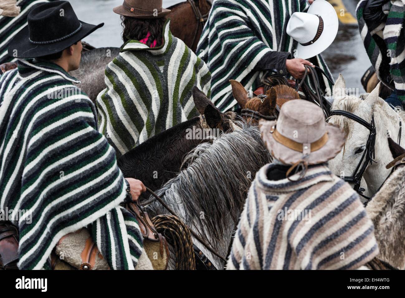 Ecuador, Ambato, Pelileo, concentration of riders in traditional poncho over a local festive celebration Stock Photo