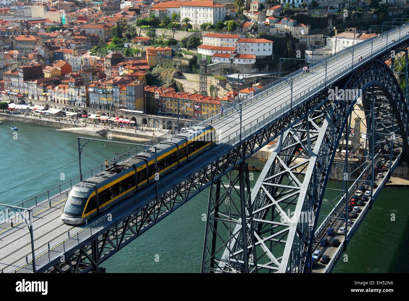 Portugal, North Region, Porto, historical center listed as World Heritage by UNESCO, streetcar on the Eiffel style Dom Luis I bridge over the Douro River and Ribeira cais Stock Photo