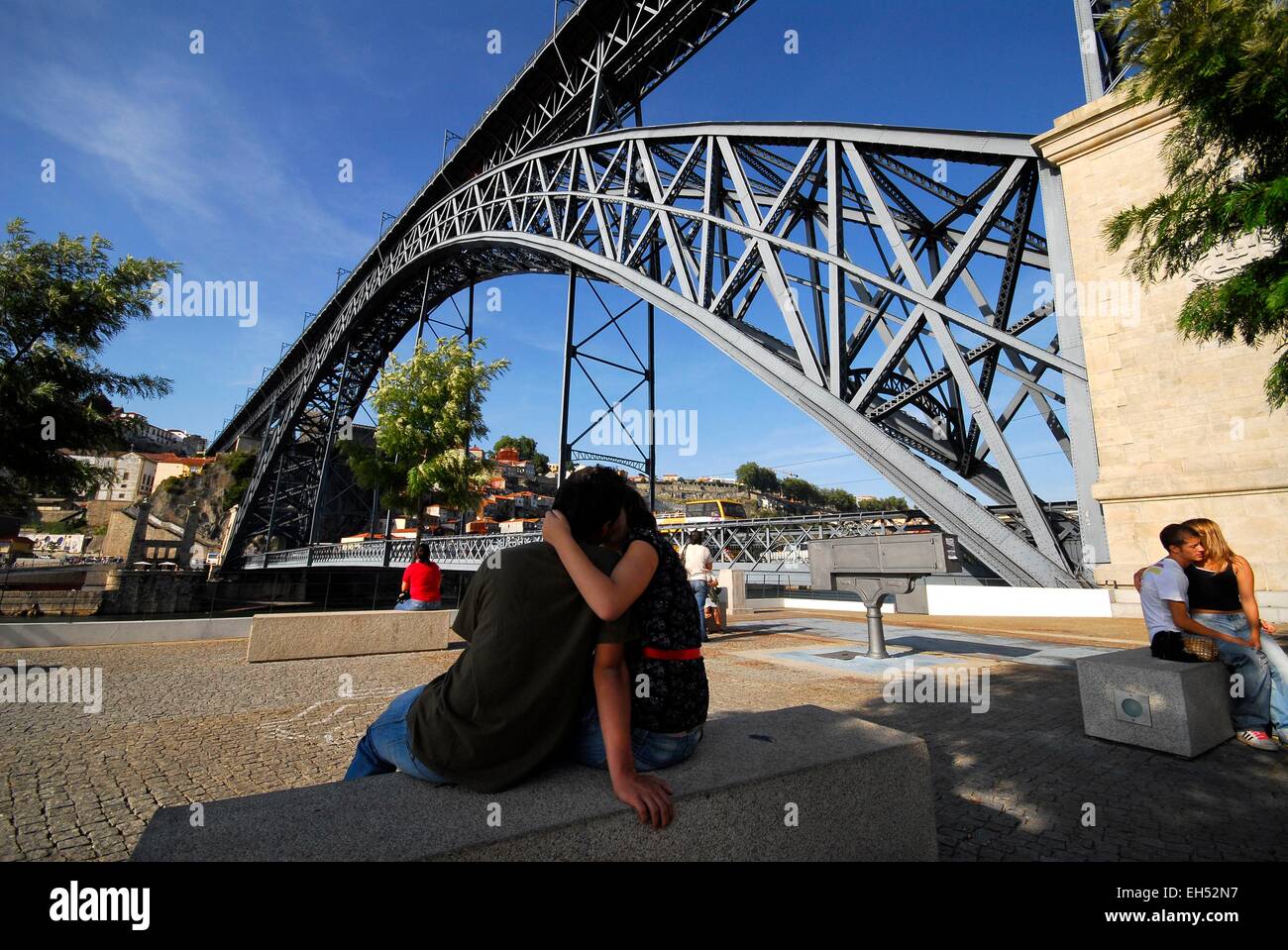Portugal, North Region, Porto, historical center listed as World Heritage by UNESCO, lovers at the foot of the Eiffel style Dom Luis I bridge Stock Photo