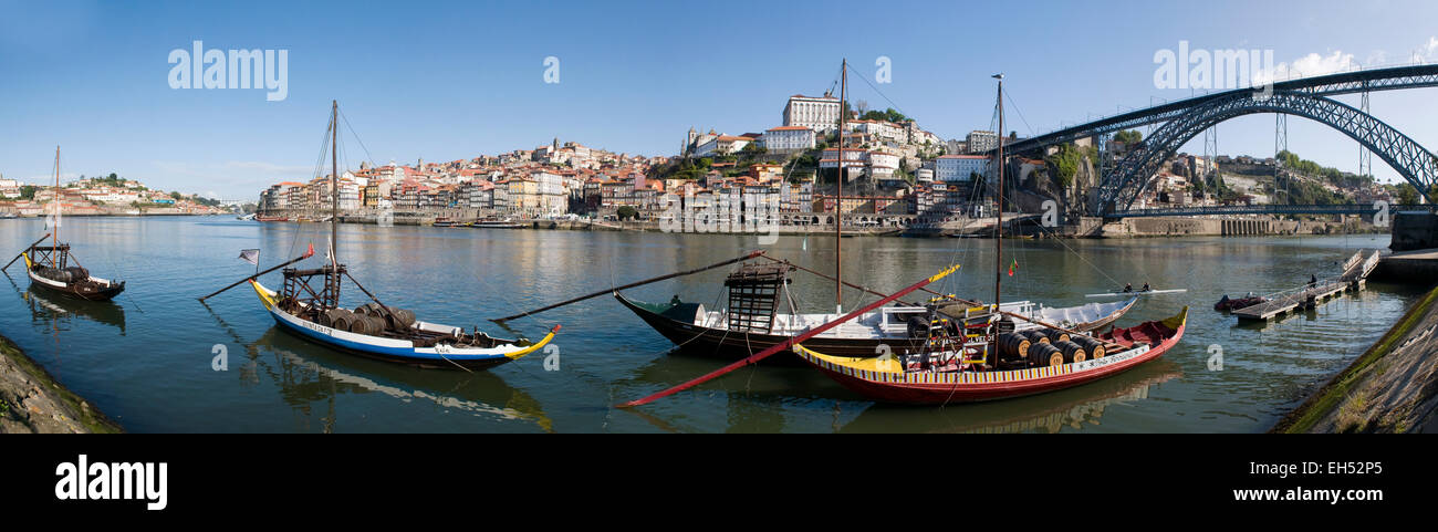 Portugal, North Region, Porto, historical center listed as World Heritage by UNESCO, Cais de Ribeira historic district, Barco Rabelo boats formerly used to transport port on the Douro River and Eiffel style Dom Luis I bridge Stock Photo