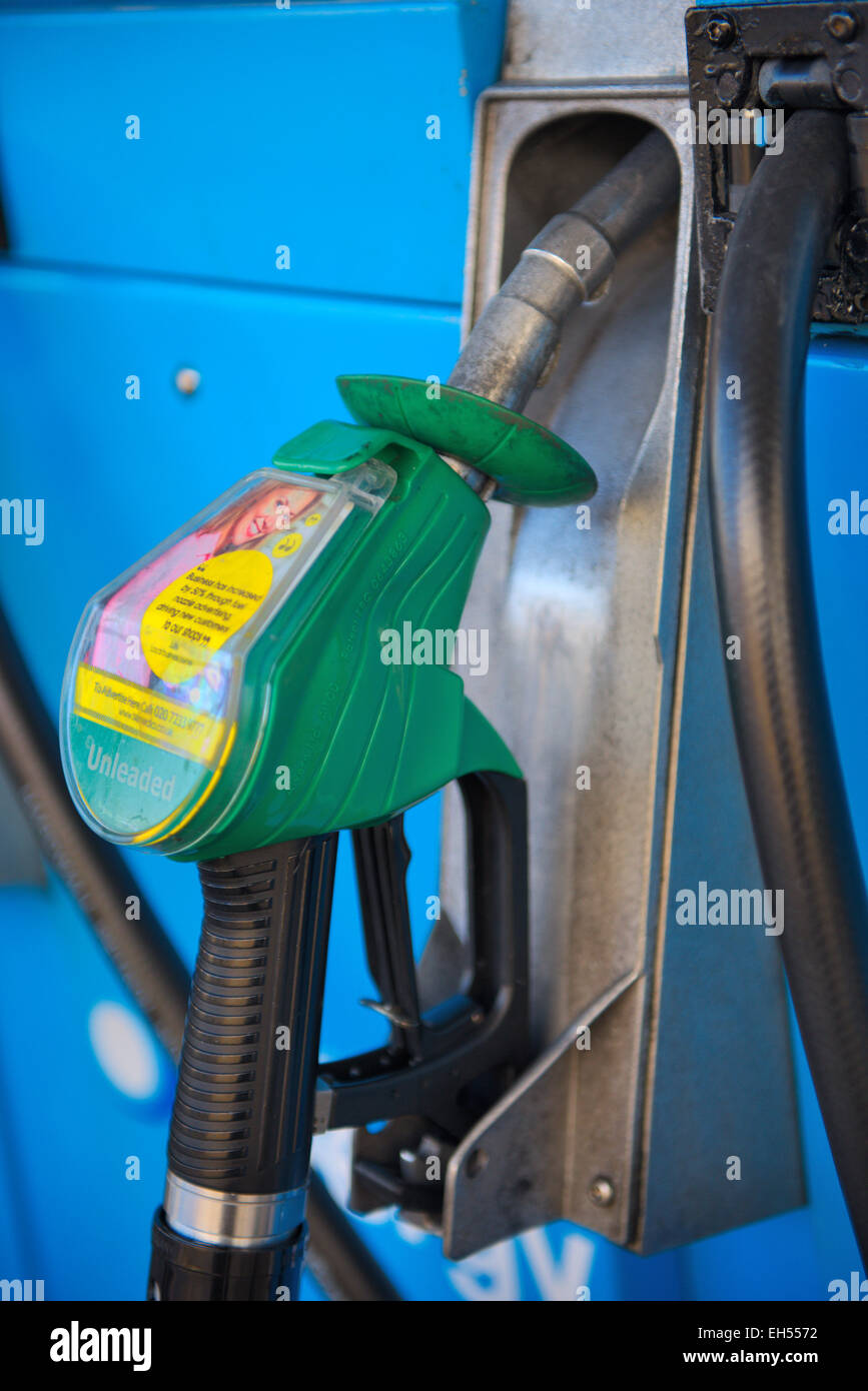 Petrol pump nozzle with sticker advertising for local business to place ad on nozzle Stock Photo
