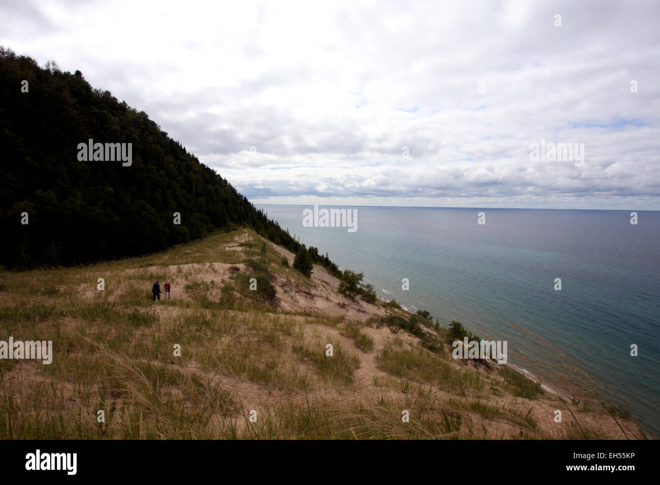 Hikers walk near Baldy in the Arcadia Dunes/C.S. Mott Nature Preserve in Northwest Michigan. Stock Photo