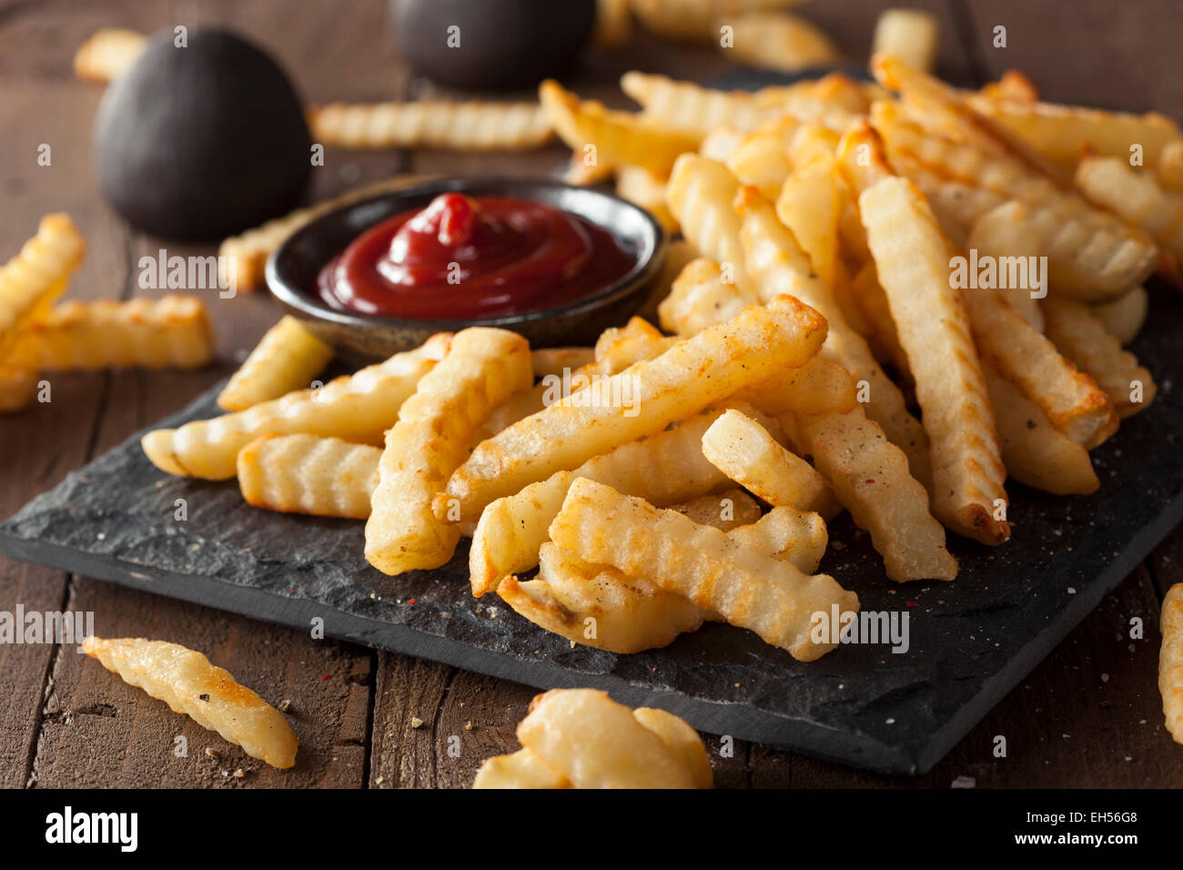 Unhealthy Baked Crinkle French Fries with Ketchup Stock Photo Alamy