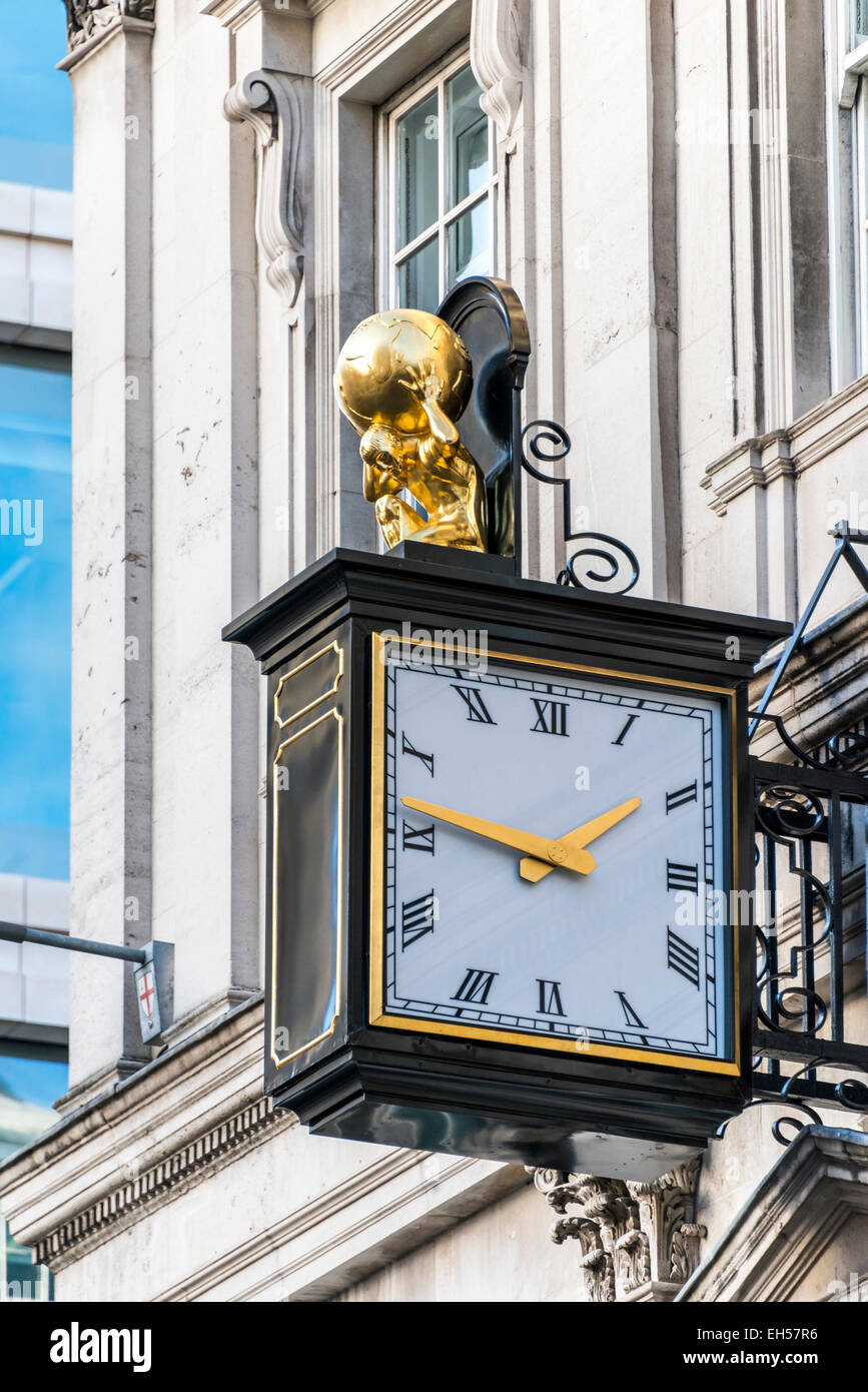 The clock on Atlas House, Cheapside London that was originally home to the Atlas Assurance Company. Atlas is on top of the clock Stock Photo