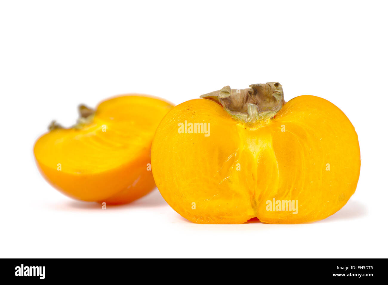 Side view of a sharon / persimmon on white background. Stock Photo