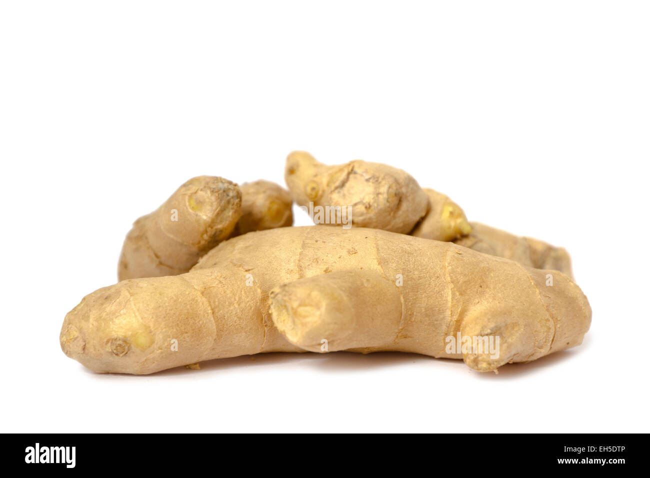 Organic and fresh ginger root on white background. Stock Photo