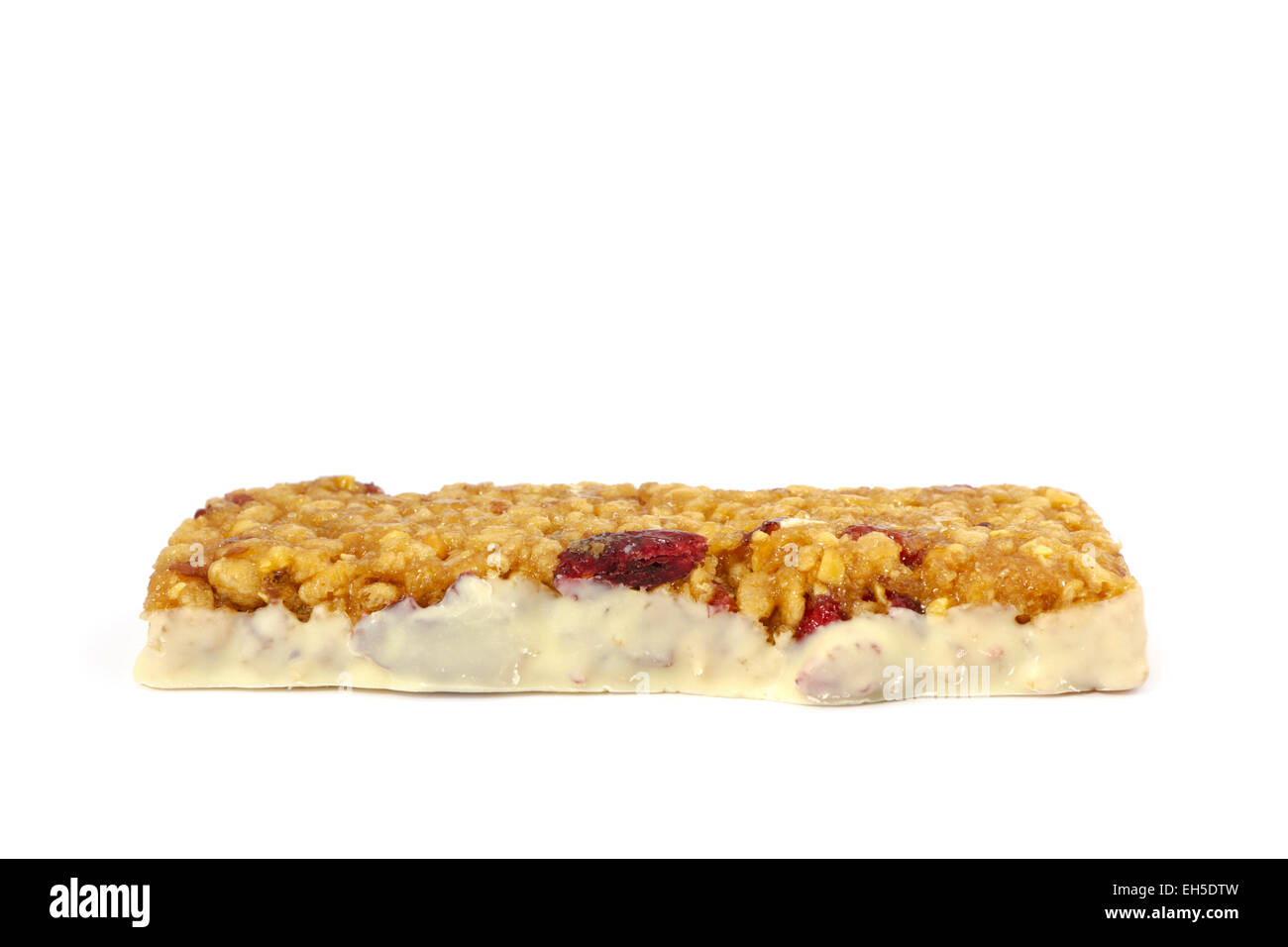 Raw Low carbohydrate bar with cranberries on white background. Stock Photo