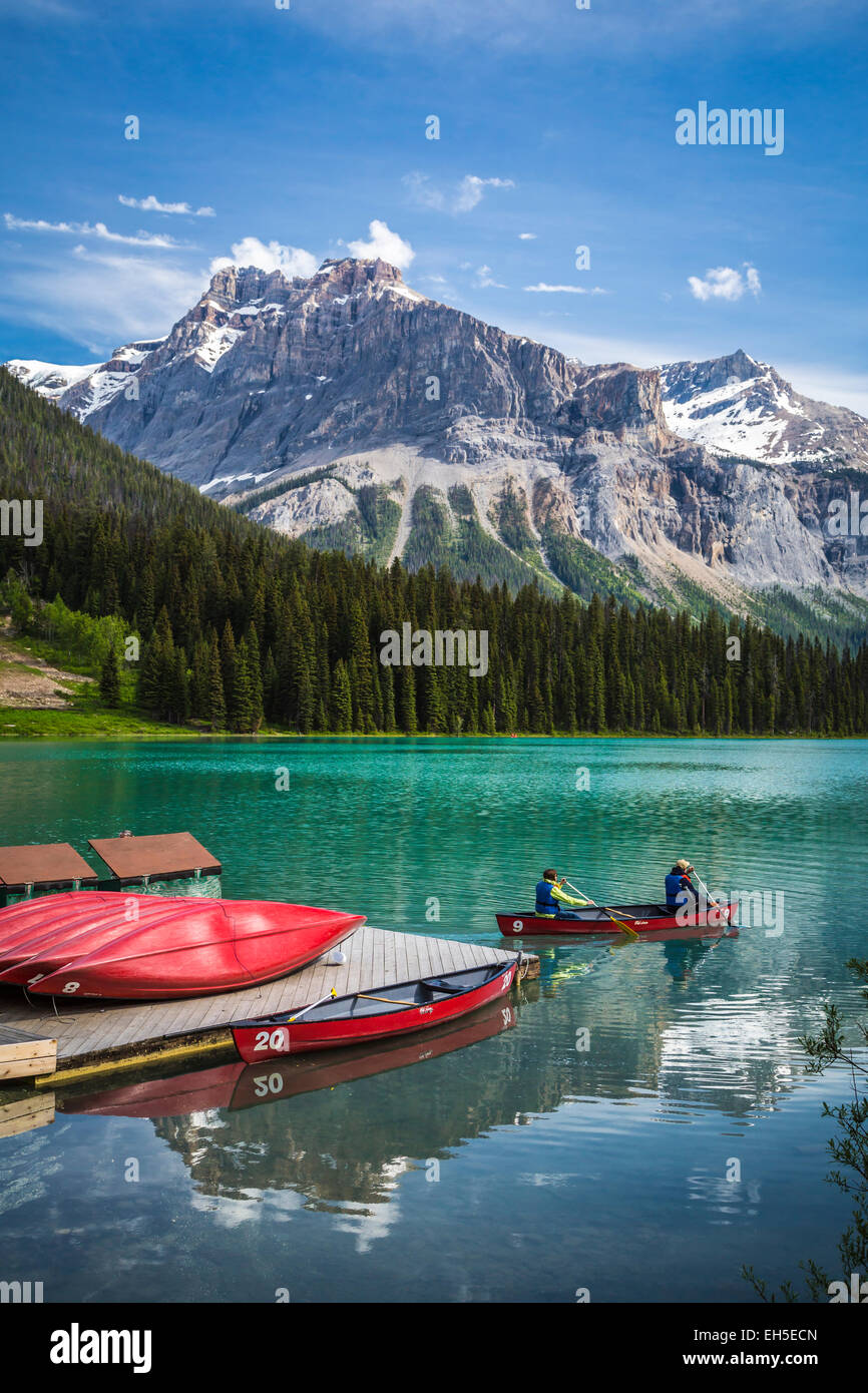 A canoe with mountain reflections on Emerald Lake, Yoho National Park