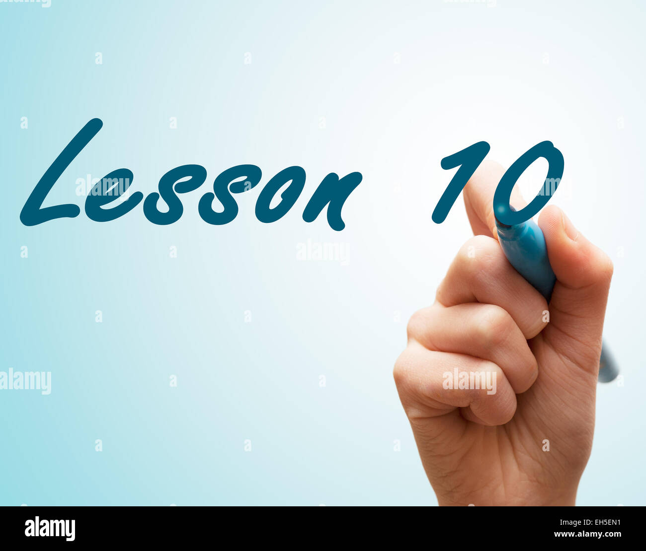 Hands with pen writing on screen lesson 10 Stock Photo - Alamy