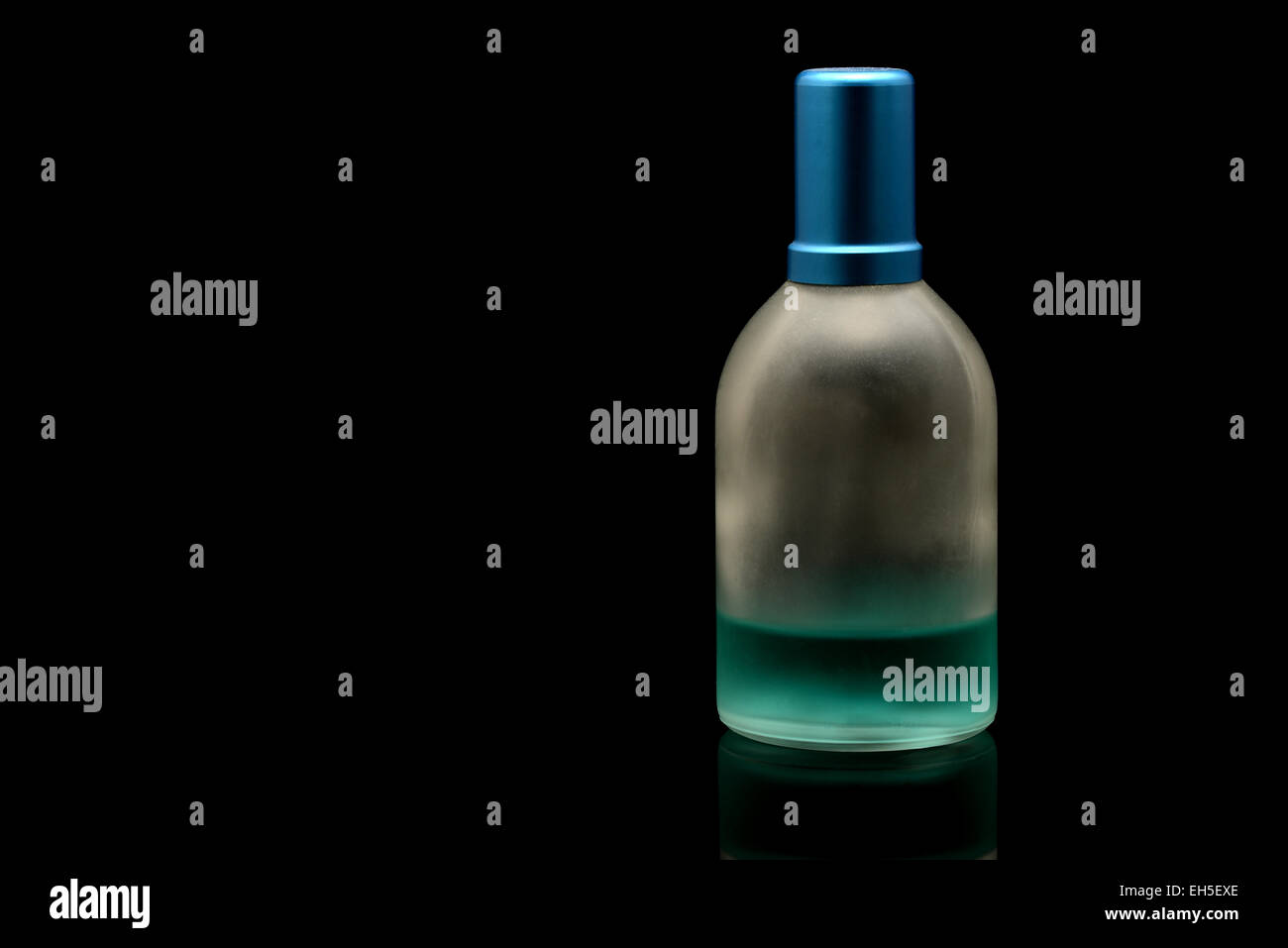 Perfume bottle half empty Stock Photo Alamy