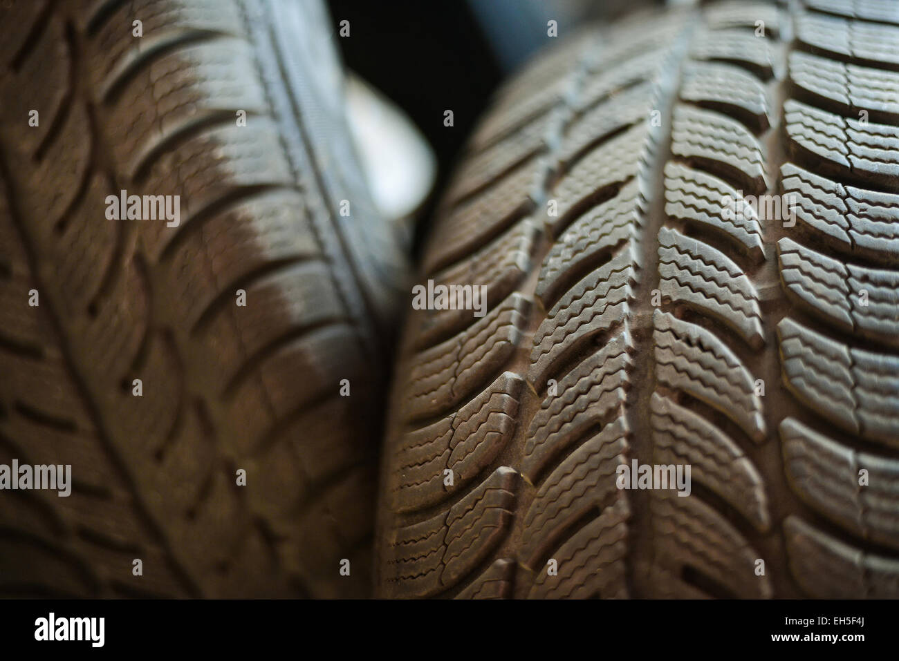Used car tires in a warehouse in natural light Stock Photo