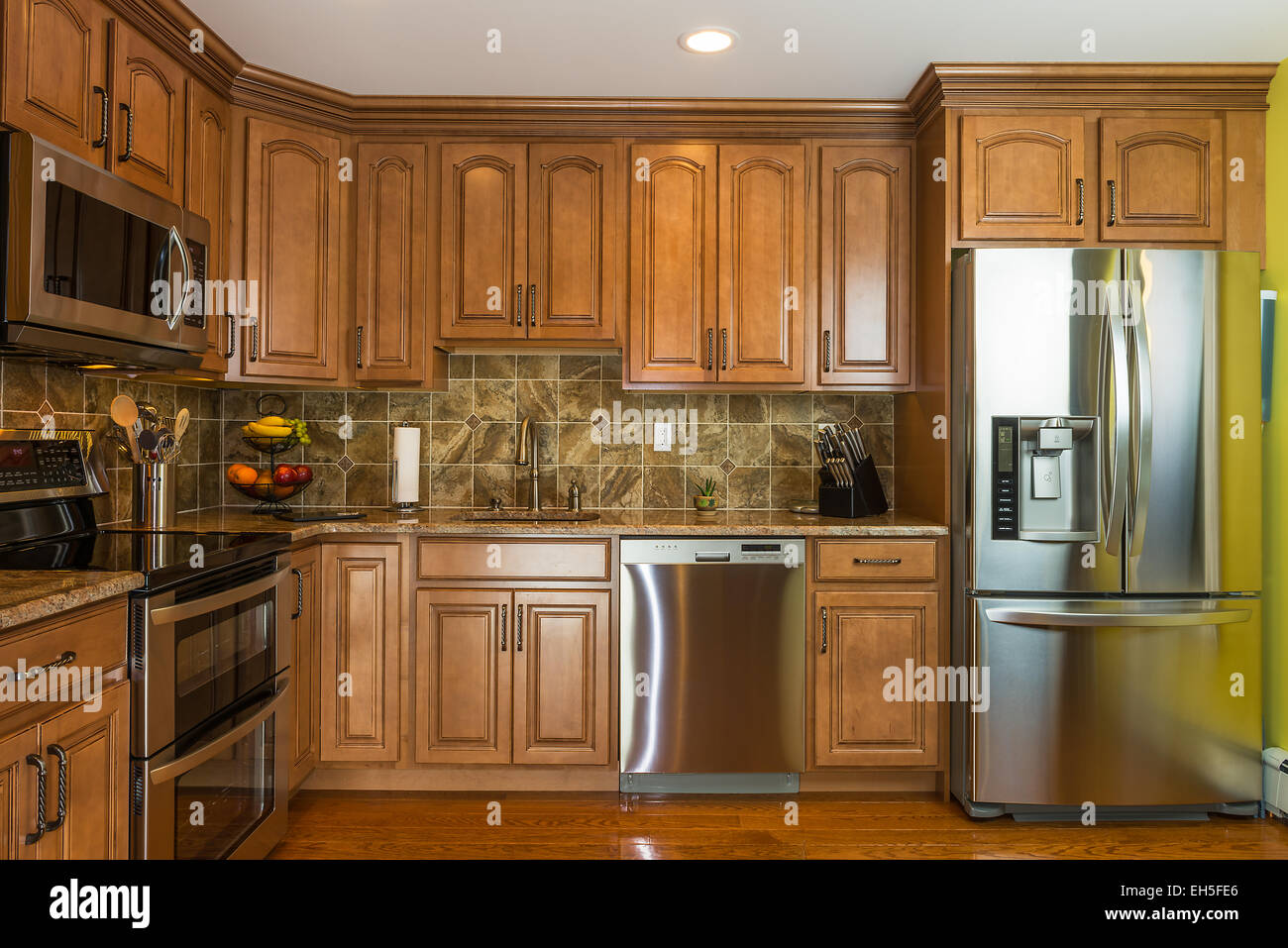 Kitchen In Luxury Home With Mocha Wood Cabinet Stock Photo Alamy   Kitchen In Luxury Home With Mocha Wood Cabinet EH5FE6 