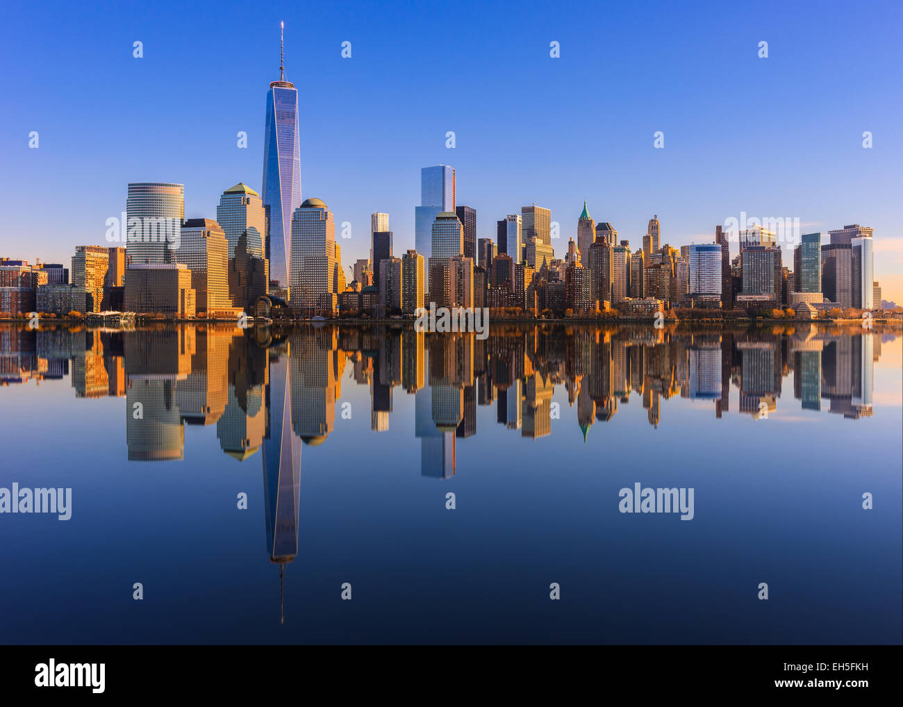 Lower Manhattan skyline panorama over East River with reflection at ...