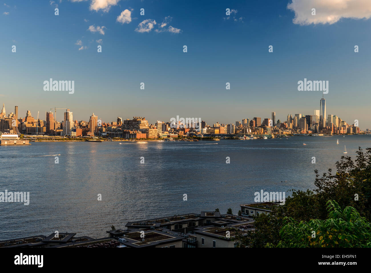 New York City midtown skyline at sunset over Hudson river Stock Photo ...