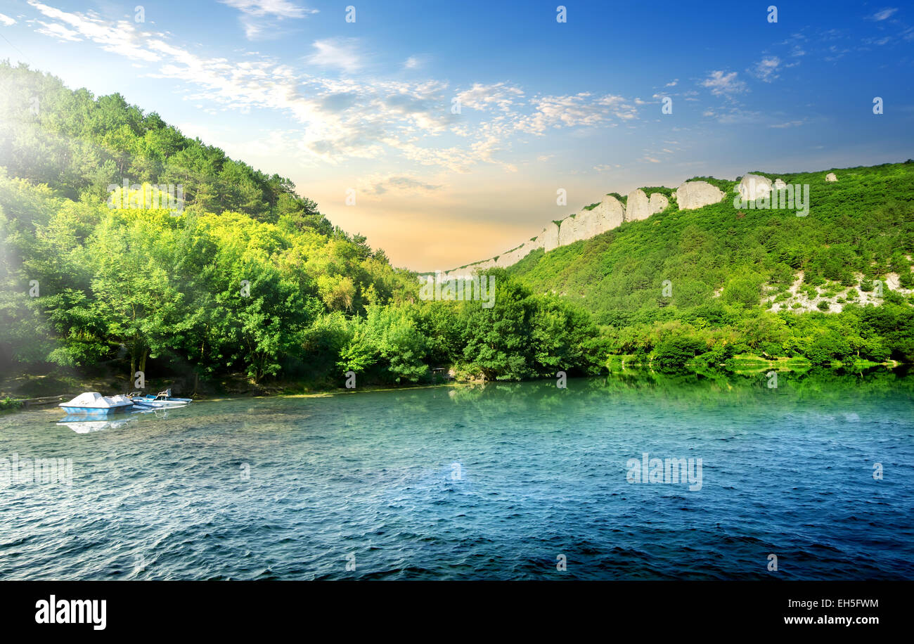 Tranquil backwater in mountains in sunny morning Stock Photo