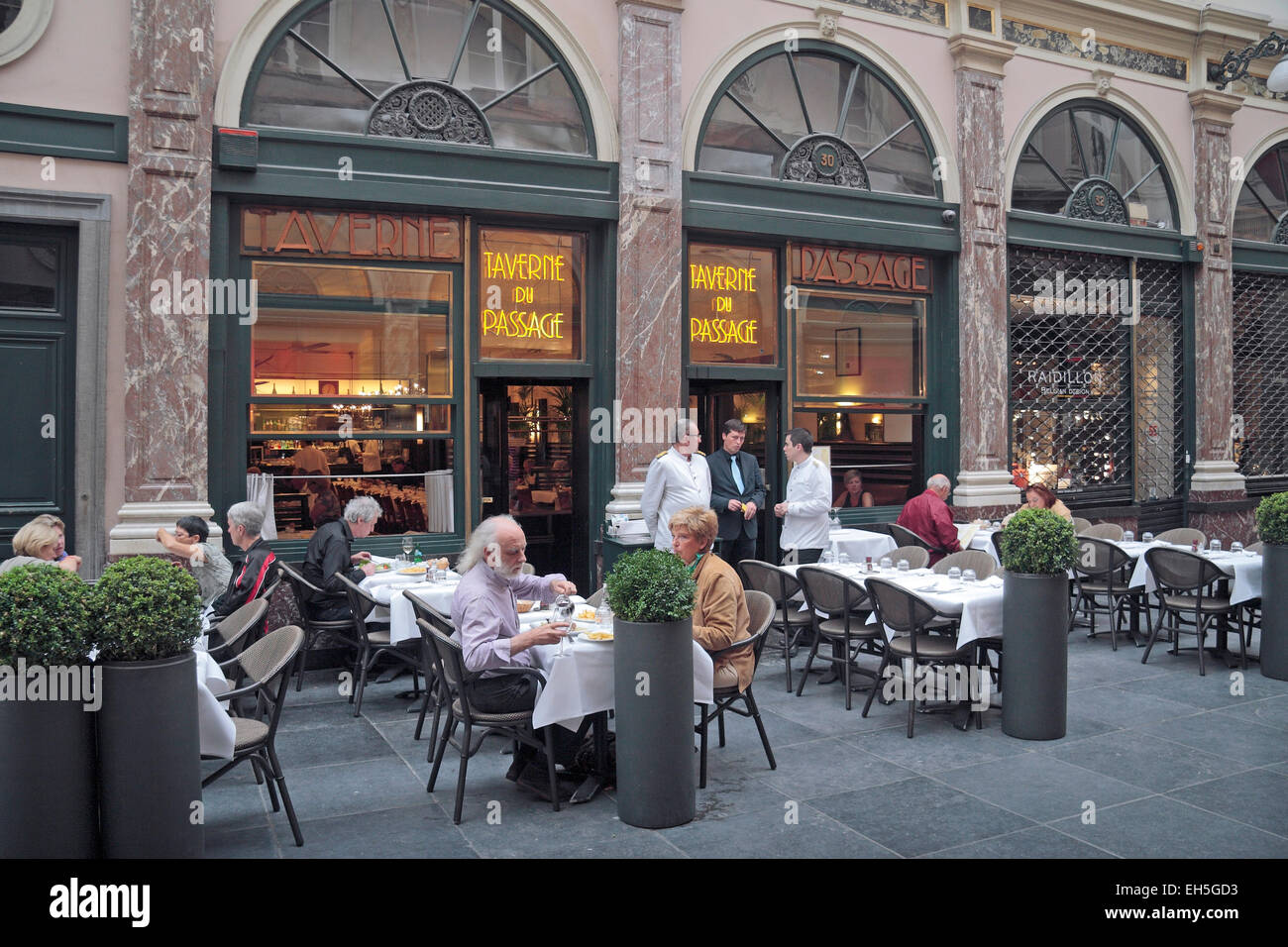 Outdoor tables at the Belgian restaurant Taverne du Passage in Brussels, Belgium. Stock Photo