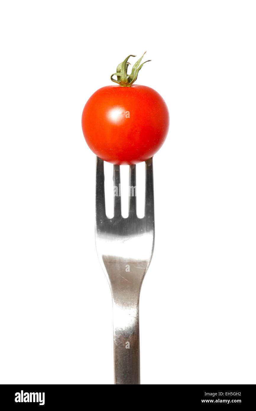 Organic Cherry Tomato on a fork. Stock Photo