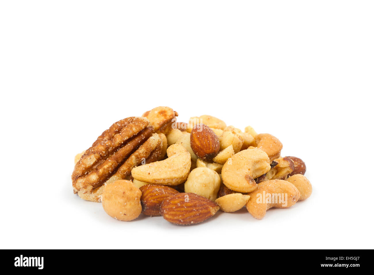 A stack / heap of salted mixed nuts. Stock Photo