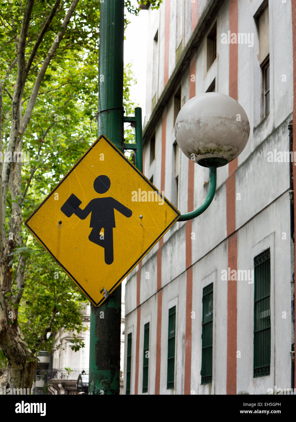 Argentina, Buenos Aires, Almagro, Hipolito Yrigoyen, school warning sign on lamp post Stock Photo