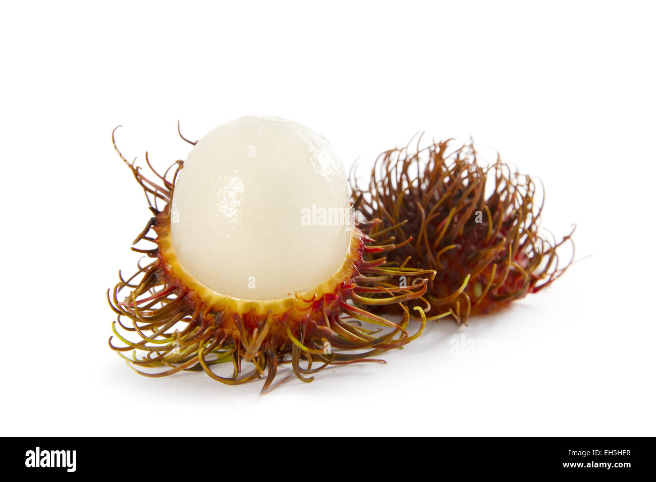Inside view of an tropical rambutan fruit on white background. Stock Photo