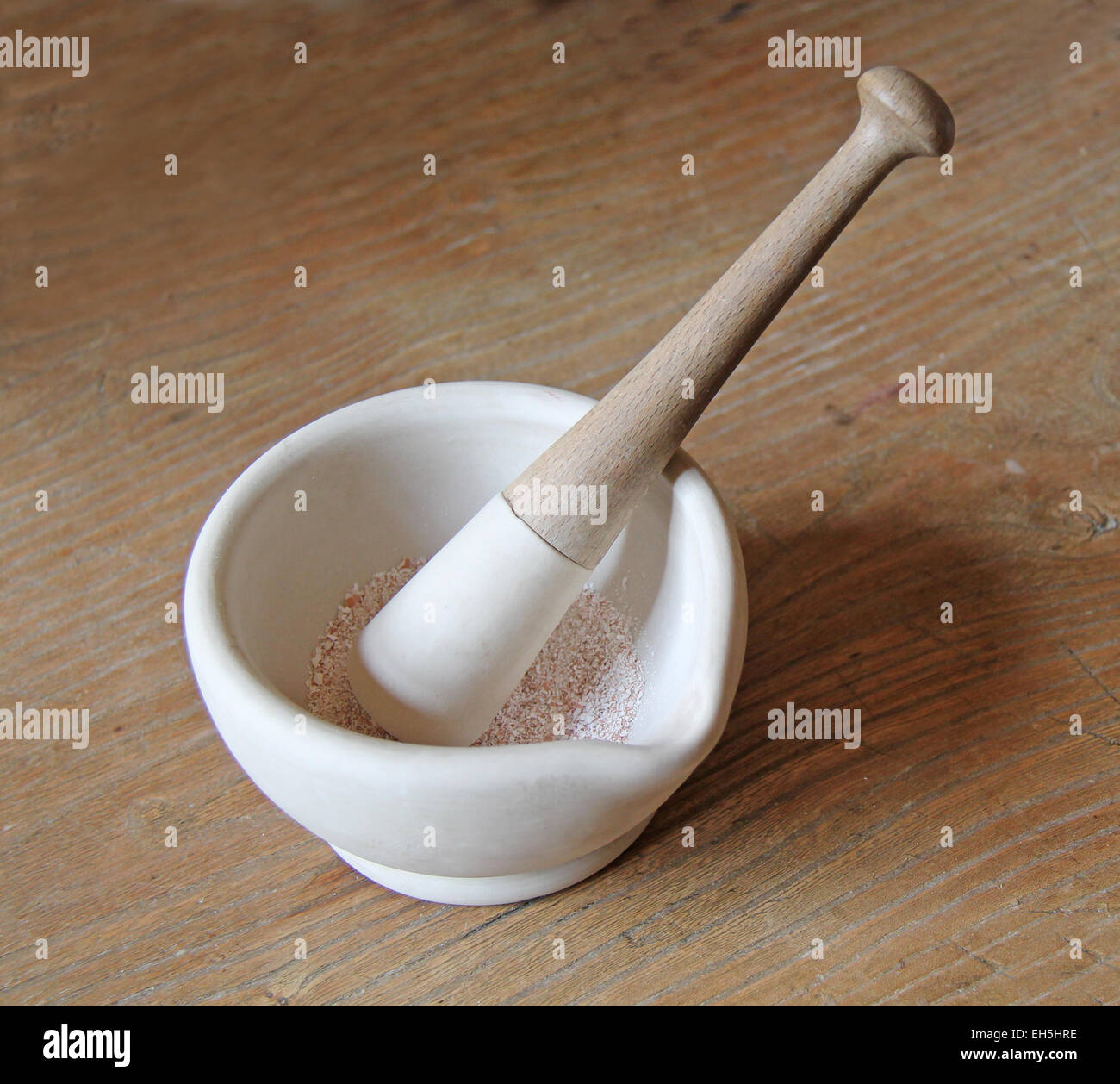A Pestle and Mortar with Ground Up Spices. Stock Photo