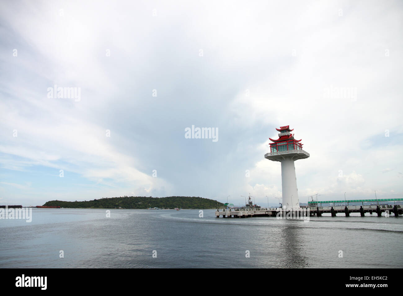 Lighthouse on coastal area and Overcast sky background. Stock Photo
