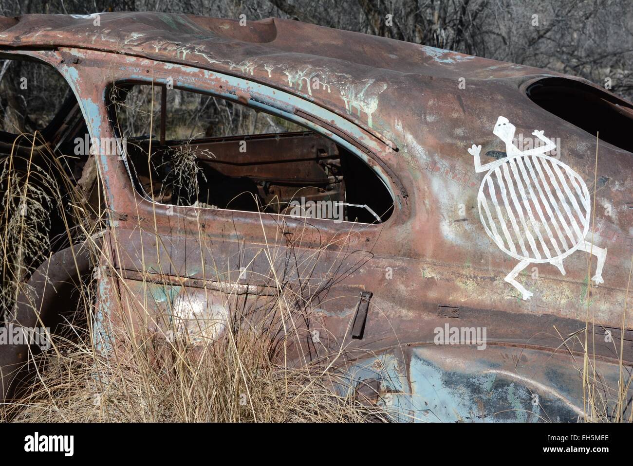Turtle graffiti on old derelict vehicle Down near San Vicente Creek Trail, Silver City, New Mexico - USA Stock Photo