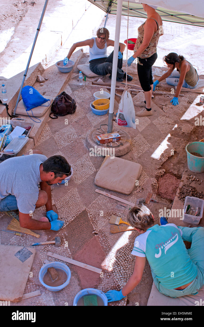 Archaeologists working in the ruins of ancient Messini, The Peloponnese, Greece Stock Photo